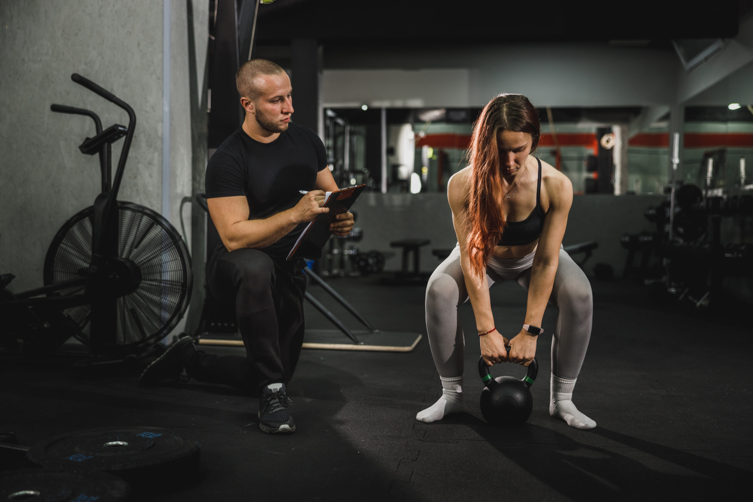 Fitness Instructor Working With Clients